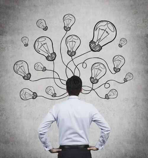 businessman with many drawing bulbs over head